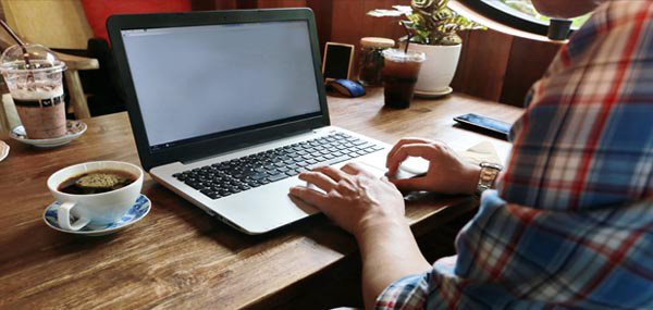 man with hands on computer mobile