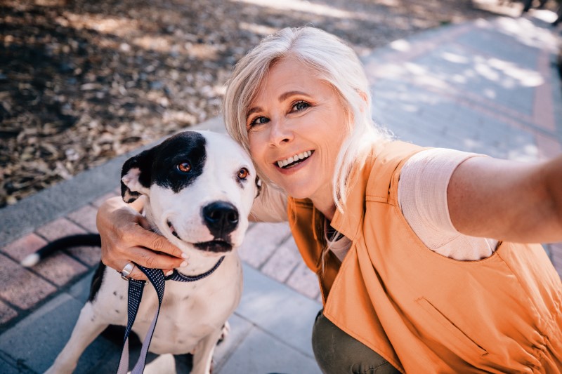 medicare aged woman with dog